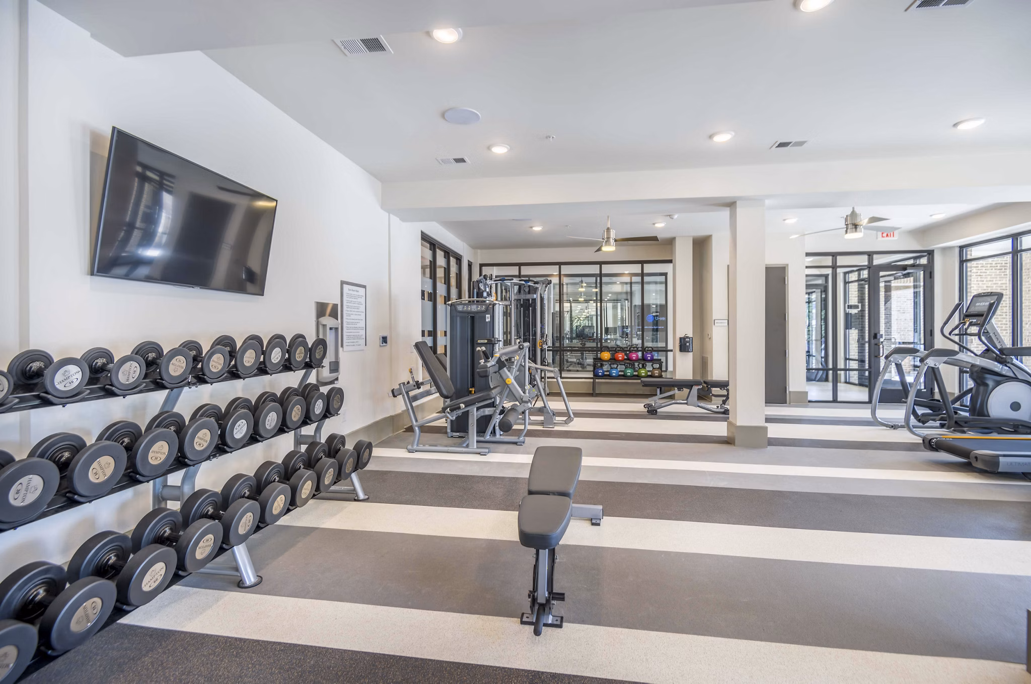 State-of-the-art fitness center with modern equipment at Leigh House Apartments