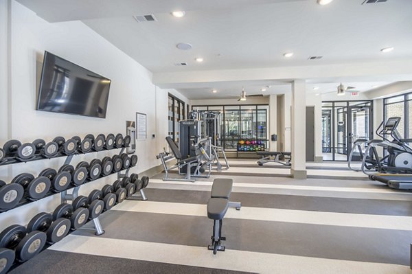 State-of-the-art fitness center with modern equipment at Leigh House Apartments