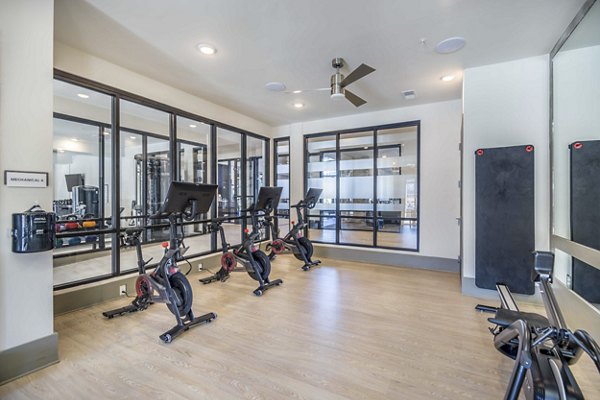 Yoga and spin studio featuring modern equipment at Leigh House Apartments