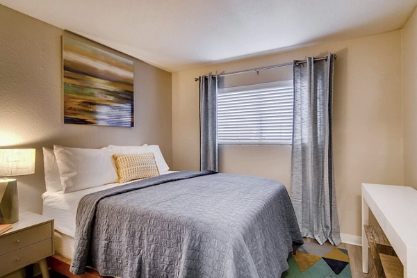 Cozy bedroom with modern furnishings at Arterra Apartments