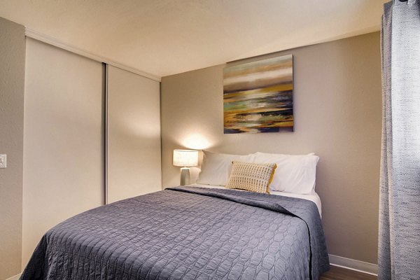 Spacious bedroom with modern decor at Arterra Apartments, luxury living in city center