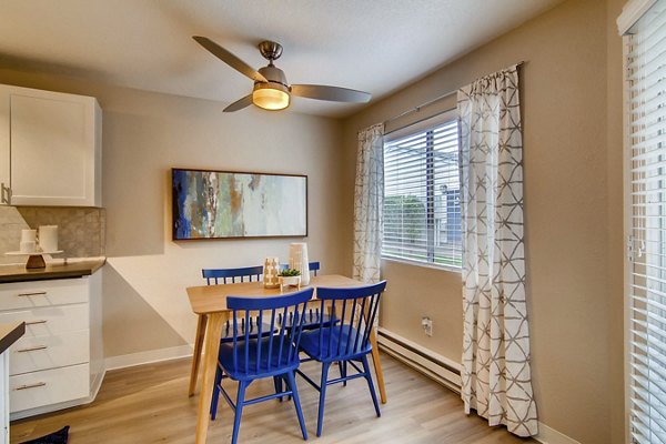 Dining area featuring modern furniture and stylish lighting at Arterra Apartments