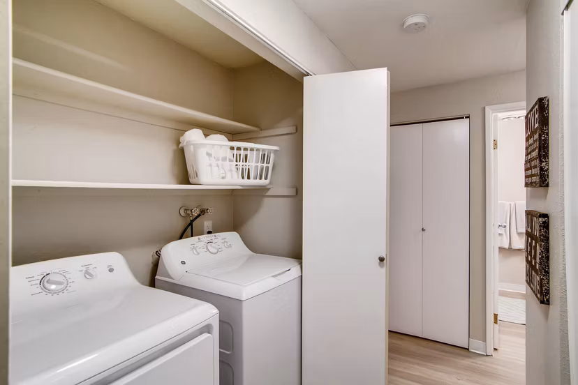 Laundry room featuring modern appliances in Arterra Apartments