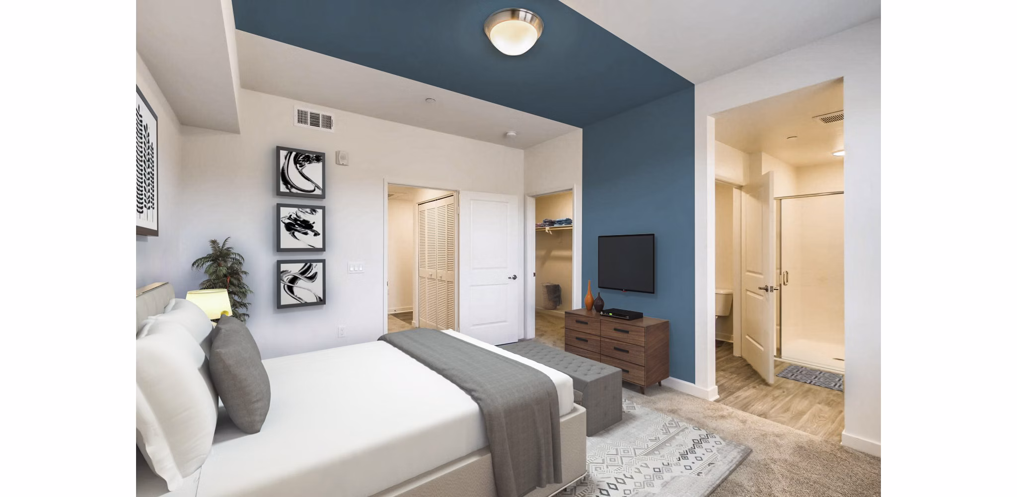 Cozy bedroom with contemporary dÃ©cor in Ascent at Campus of Life Apartments