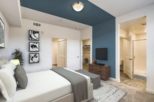 Cozy bedroom with contemporary dÃ©cor in Ascent at Campus of Life Apartments