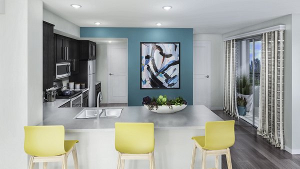 Dining room at Ascent at Campus of Life Apartments featuring elegant table settings and modern lighting fixtures