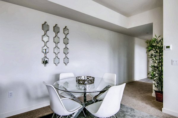 Dining room with modern furnishings at Ascent at Campus of Life Apartments, featuring elegant lighting and spacious design