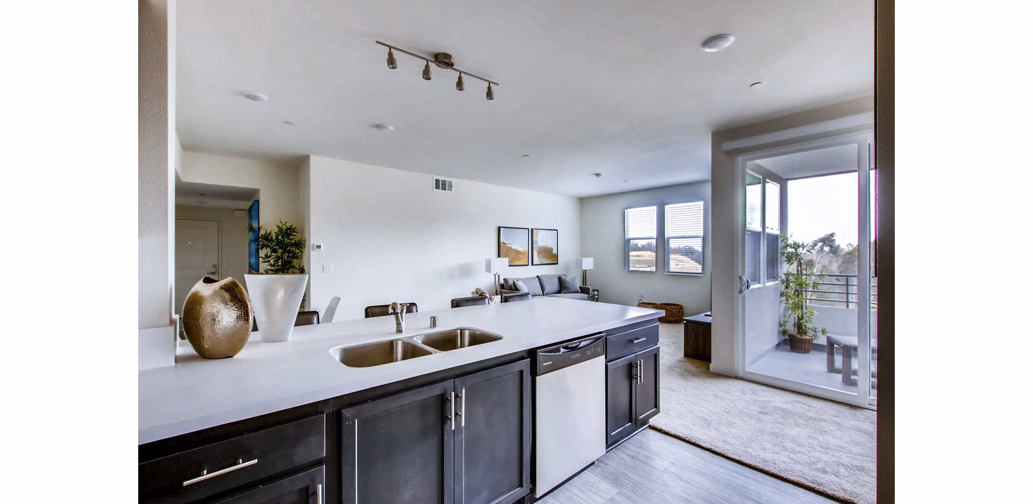 Ascent at Campus of Life Apartments: Modern kitchen with stainless steel appliances and granite countertops