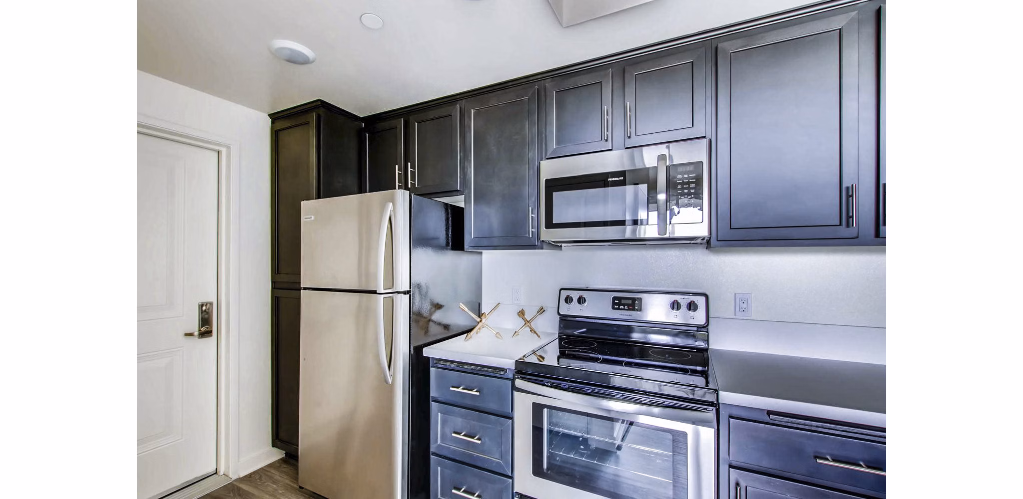 Modern kitchen with stainless steel appliances in Ascent at Campus of Life Apartments