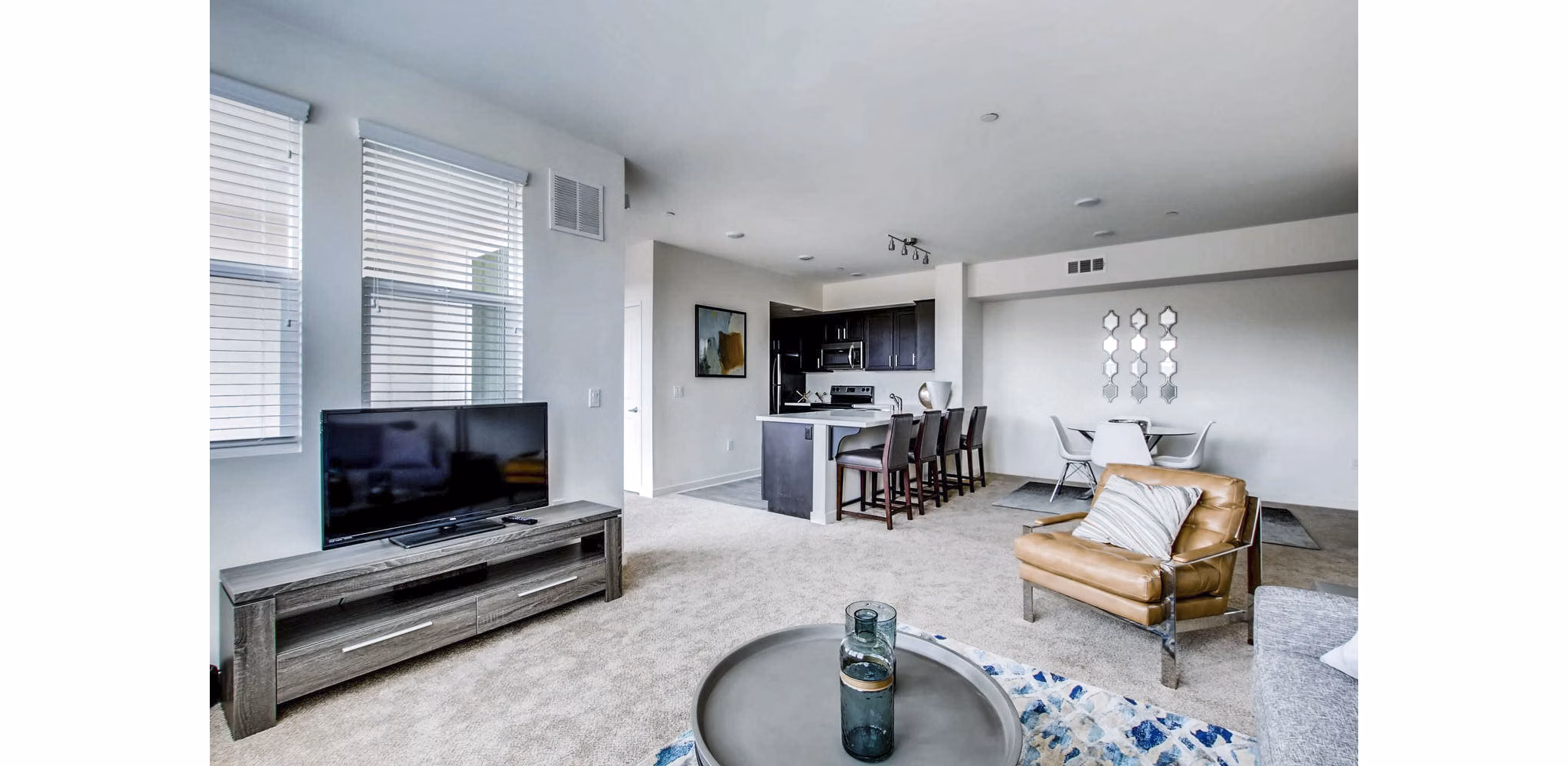 Spacious living room with modern furnishings at Ascent at Campus of Life Apartments