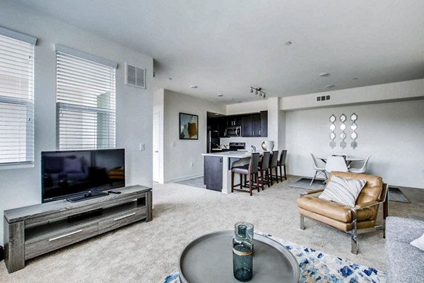 Spacious living room with modern furnishings at Ascent at Campus of Life Apartments