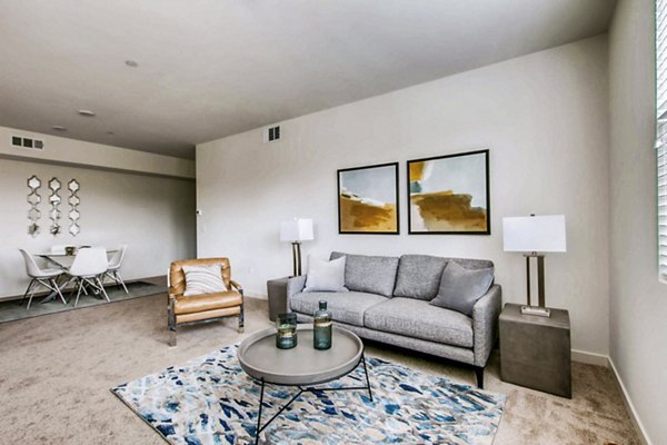 Spacious living room with modern furnishings at Ascent at Campus of Life Apartments