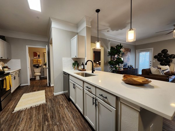 Spacious kitchen with modern appliances in Grand Villas at Tuscan Lakes Apartments