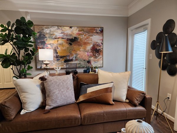 Spacious living room with modern furnishings in Grand Villas at Tuscan Lakes Apartments