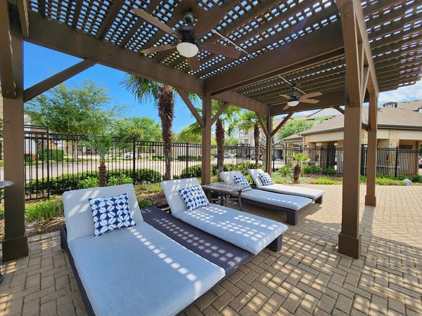 Grand Villas at Tuscan Lakes: Cozy patio with stylish seating for outdoor relaxation at premium apartments