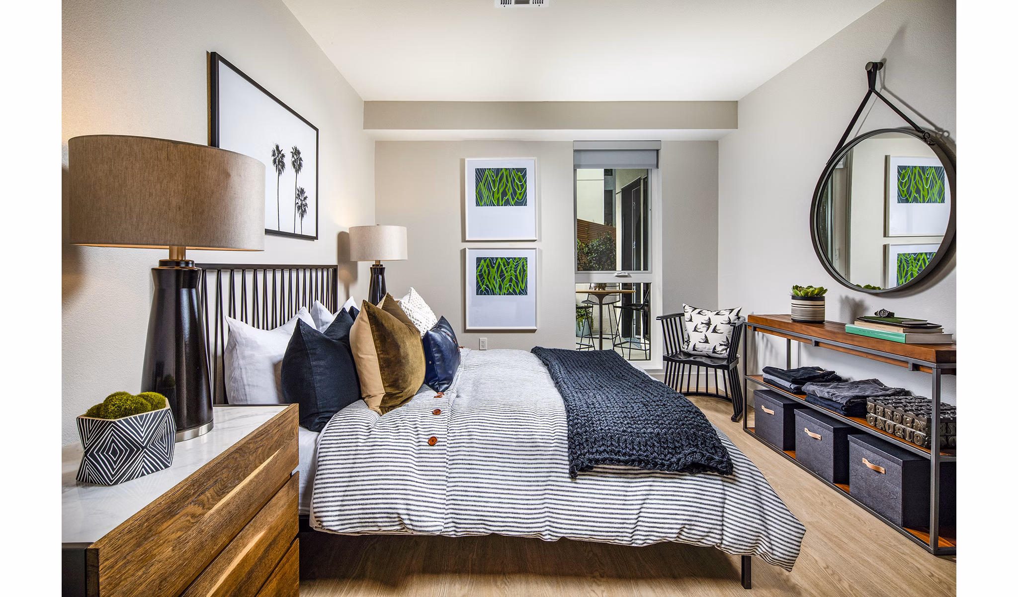 Cozy bedroom with modern decor at Llewellyn Apartments: luxury Greystar property showcasing sophisticated interiors