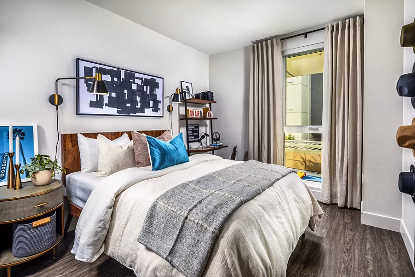 Walk-in closet with built-in shelving in a bedroom at Llewellyn Apartments