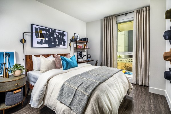 Walk-in closet with built-in shelving in a bedroom at Llewellyn Apartments