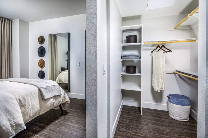 Spacious bedroom closet with ample storage at Llewellyn Apartments, offering luxurious living and modern amenities