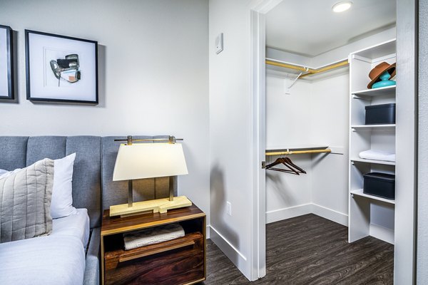 Llewellyn Apartments: Bedroom closet with ample storage and contemporary design in luxury Greystar apartments
