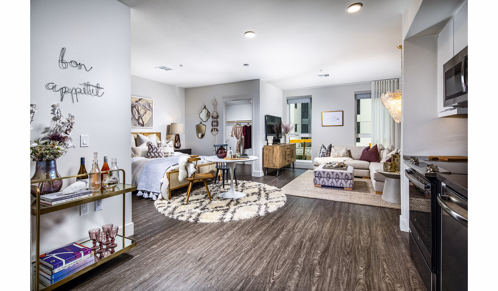 Cozy bedroom featuring modern decor and natural light at Llewellyn Apartments, a luxury property by Greystar in a prime location