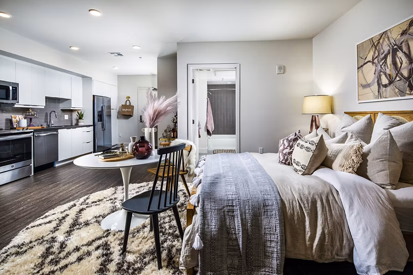 Cozy bedroom with modern furnishings at Llewellyn Apartments