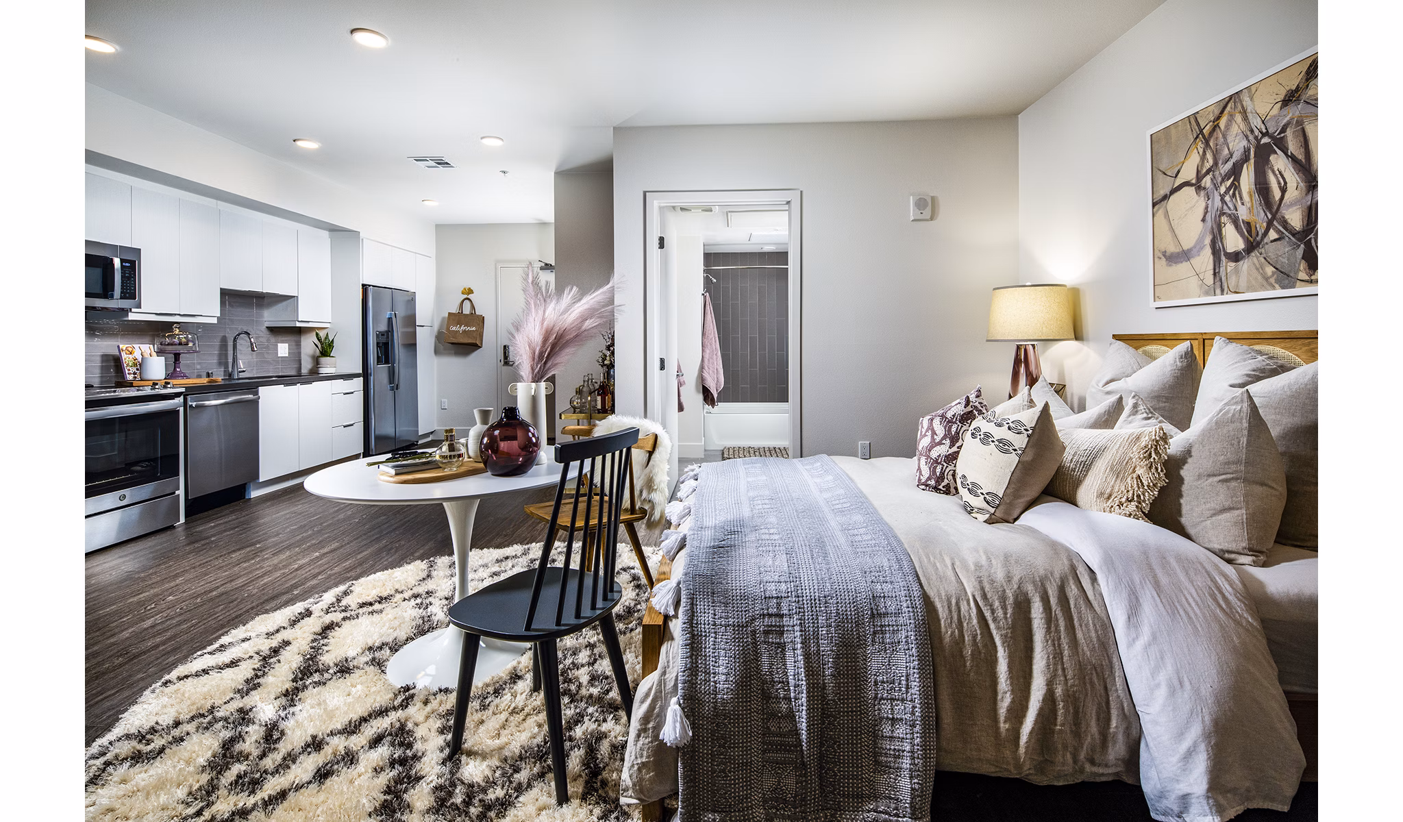 Cozy bedroom with modern furnishings at Llewellyn Apartments