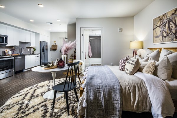 Cozy bedroom with modern furnishings at Llewellyn Apartments
