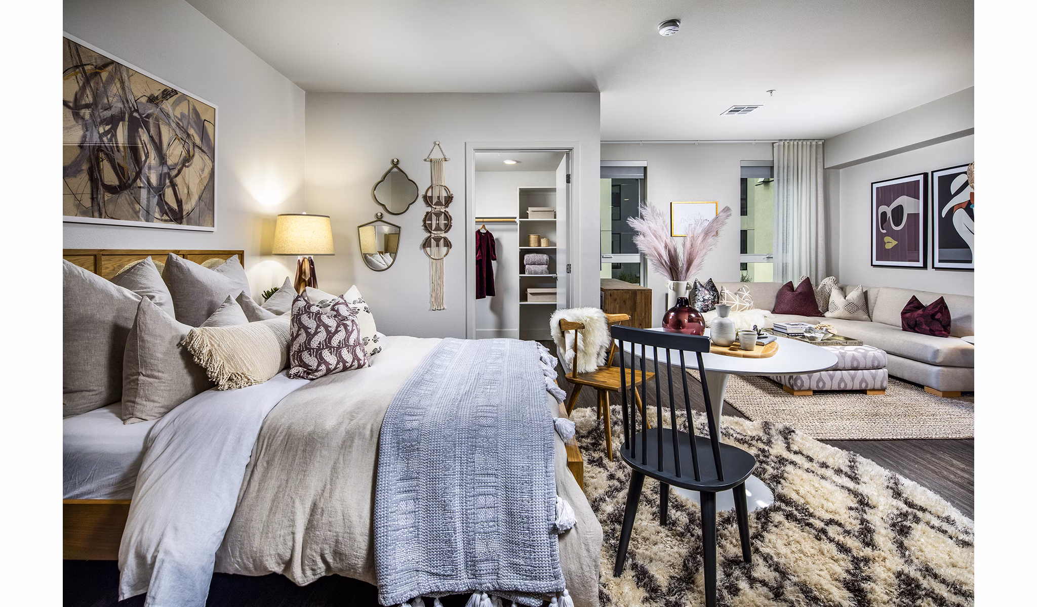 Cozy bedroom featuring modern furnishings at Llewellyn Apartments