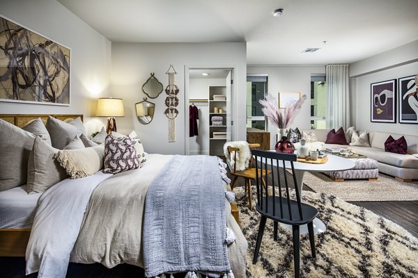 Cozy bedroom featuring modern furnishings at Llewellyn Apartments