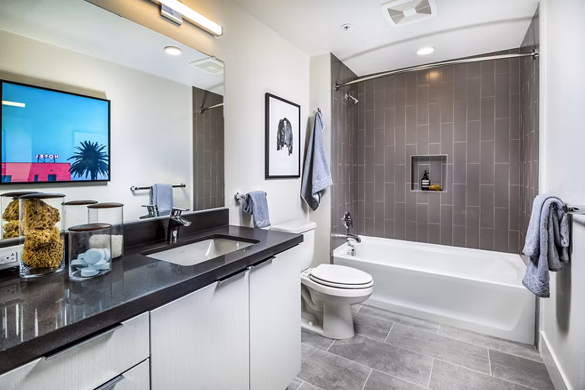 Bathroom with sleek fixtures and modern design at Llewellyn Apartments, a luxury living community by Greystar