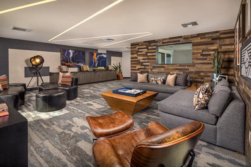 Clubhouse featuring modern seating and billiards at Llewellyn Apartments, luxury residences managed by Greystar