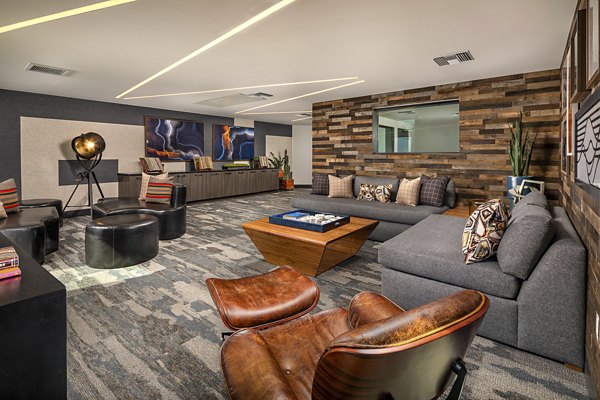 Clubhouse featuring modern seating and billiards at Llewellyn Apartments, luxury residences managed by Greystar