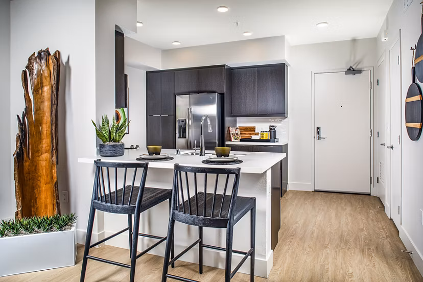 Dining room featuring contemporary design and elegant lighting in Llewellyn Apartments, a Greystar luxury apartment community
