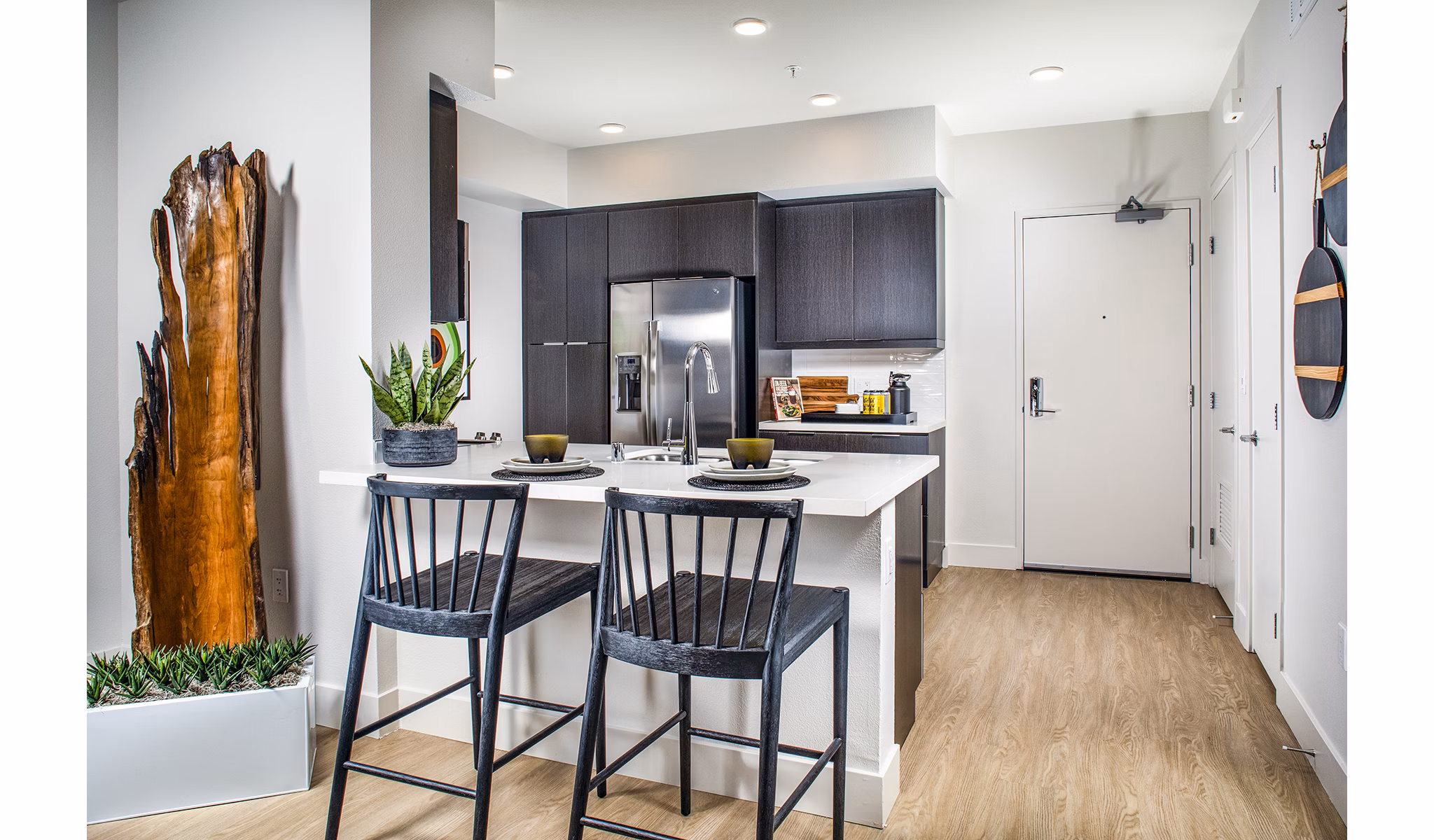 Dining room featuring contemporary design and elegant lighting in Llewellyn Apartments, a Greystar luxury apartment community