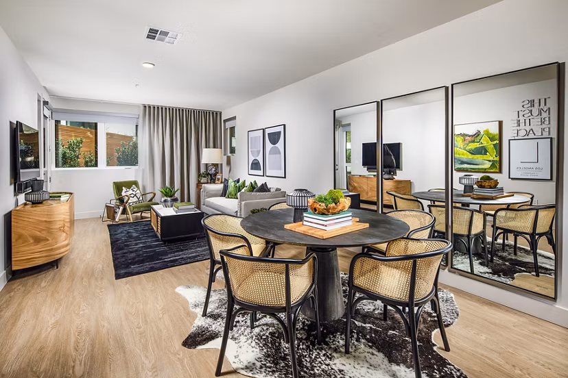 Dining room featuring elegant decor and modern lighting at Llewellyn Apartments