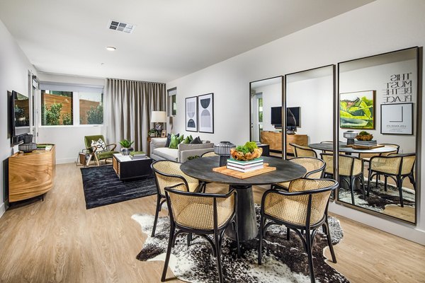Dining room featuring elegant decor and modern lighting at Llewellyn Apartments