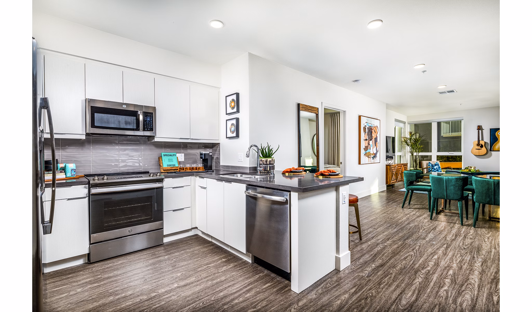 Modern kitchen with stainless steel appliances at Llewellyn Apartments