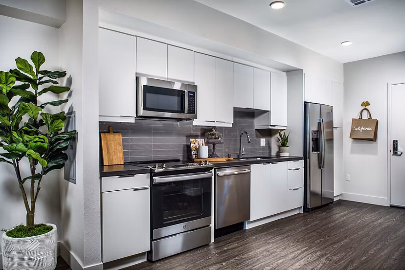 Modern kitchen with stainless steel appliances at Llewellyn Apartments, offering luxury living in a Greystar community