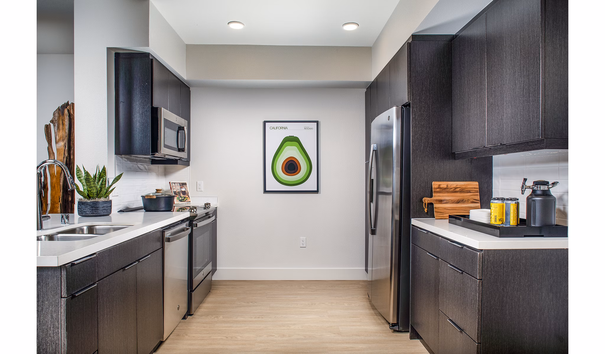 Modern kitchen with stainless steel appliances at Llewellyn Apartments, ideal for luxury living in a vibrant community