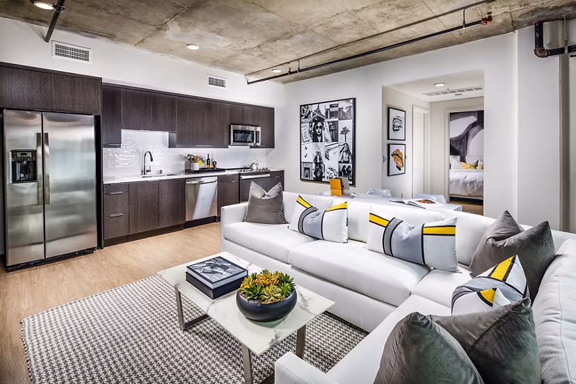 Spacious living room with modern decor at Llewellyn Apartments