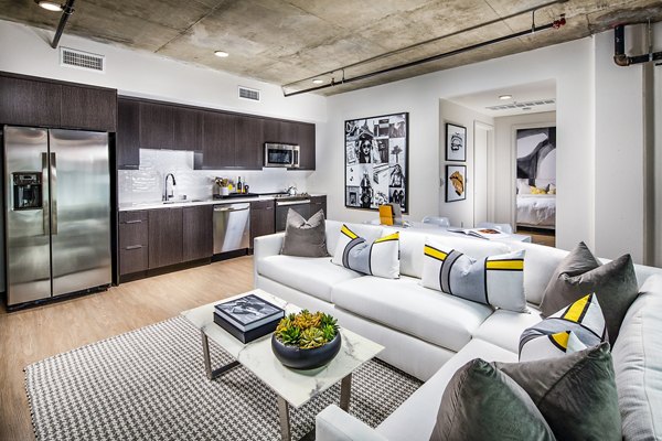 Spacious living room with modern decor at Llewellyn Apartments