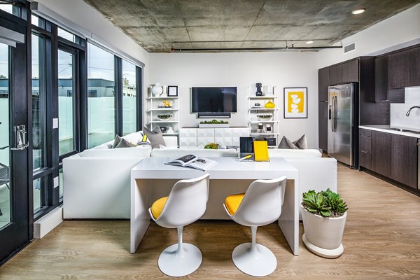 Modern living room with stylish furnishings at Llewellyn Apartments, a Greystar luxury community