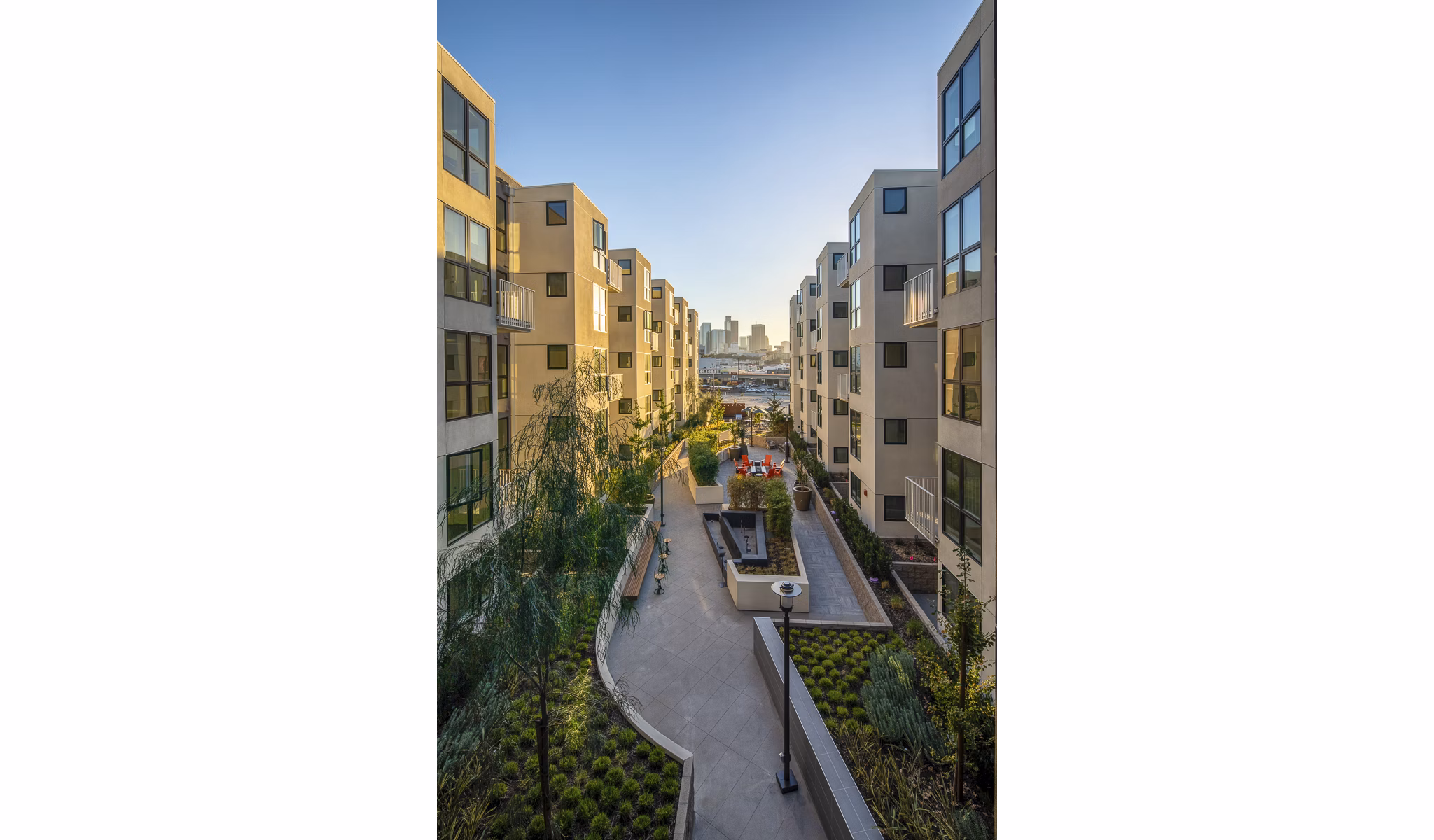 Llewellyn Apartments: Sunset view of luxury high-rise apartments in vibrant downtown setting