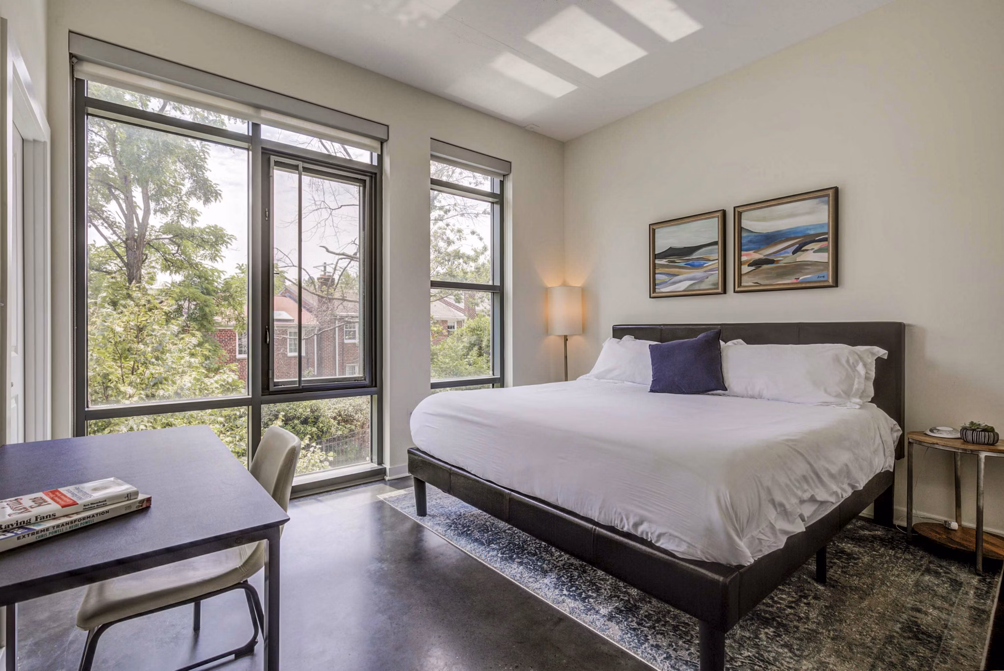 Cozy bedroom with modern furnishings at DelRay Tower Apartments