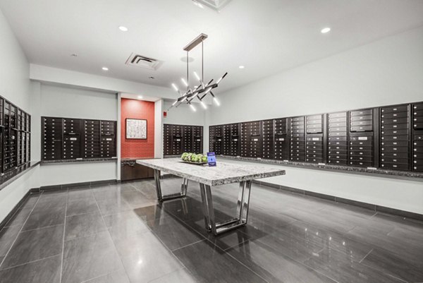 Modern mail room with secure package lockers at DelRay Tower Apartments