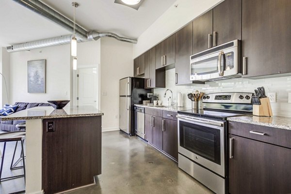 Modern kitchen with stainless steel appliances at DelRay Tower Apartments