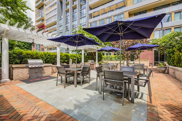 Spacious grill area on the patio at DelRay Tower Apartments, perfect for outdoor gatherings and leisure activities