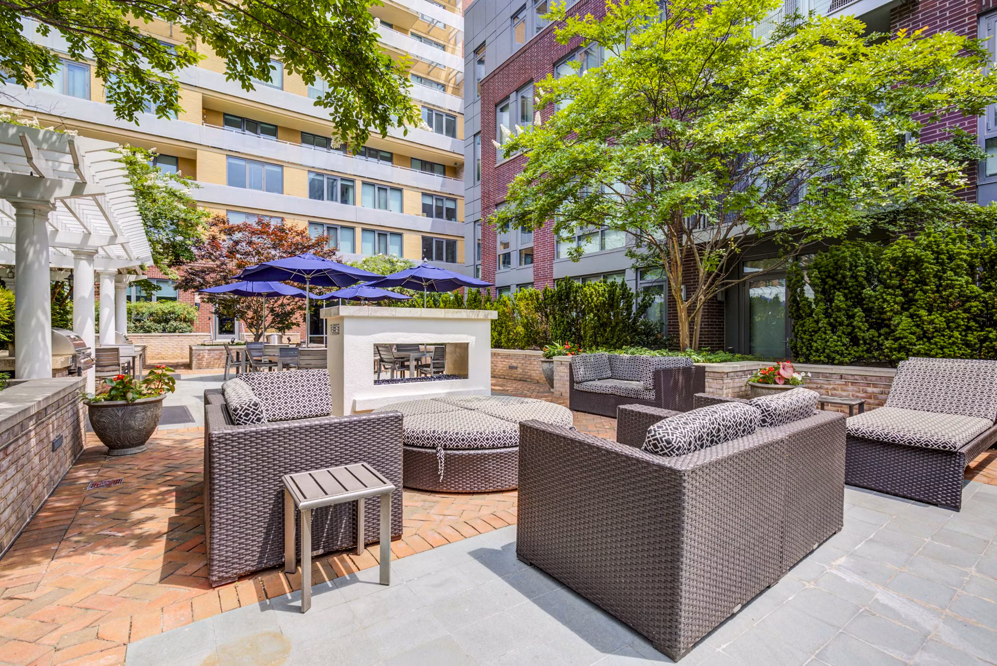 Fire pit lounge at DelRay Tower Apartments offering cozy outdoor seating with modern design elements