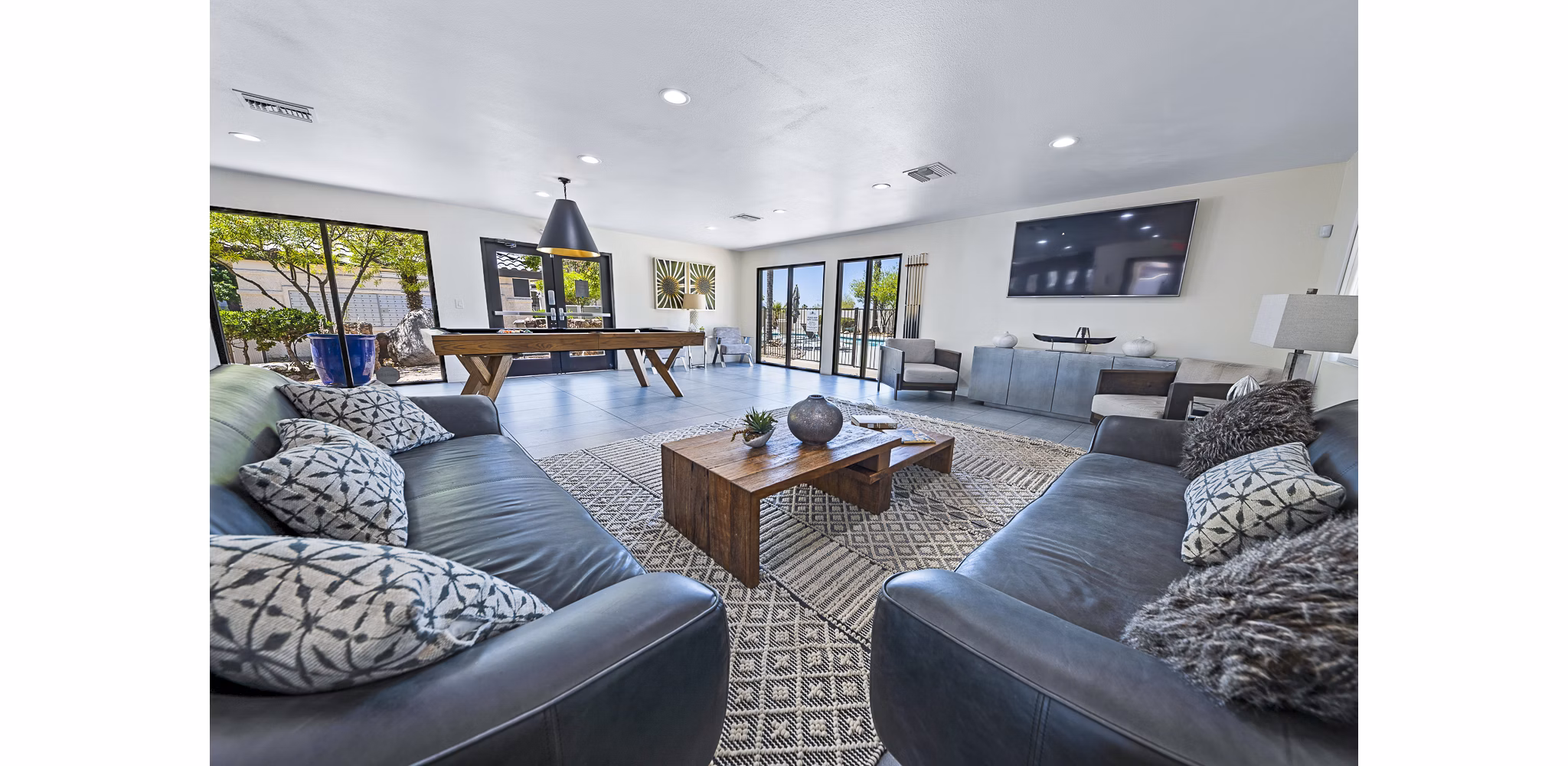 Spacious clubhouse featuring modern decor at ENVii Apartments with luxury amenities and social spaces